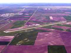 Aerial image of airport surrounded by fields